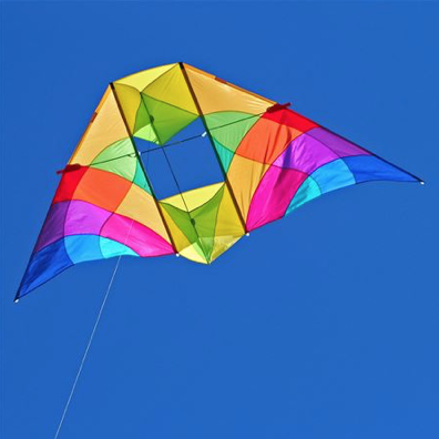 Multicolored Alpine kite flying in the sky