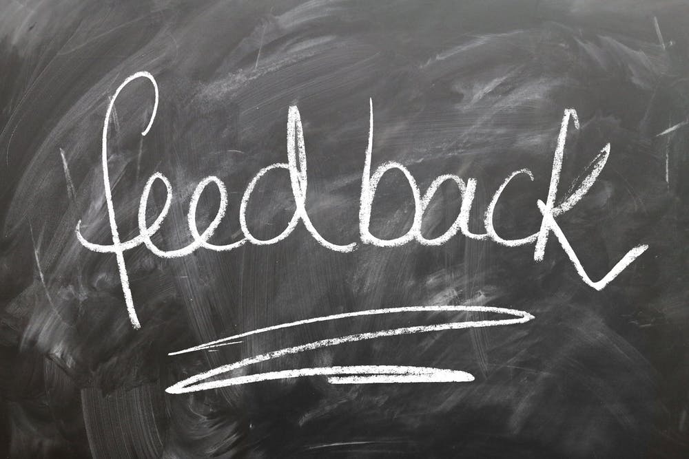 The word feedback on a chalkboard