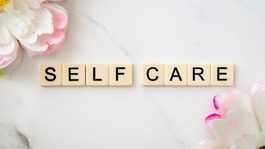 Scrabble tiles that spell self care